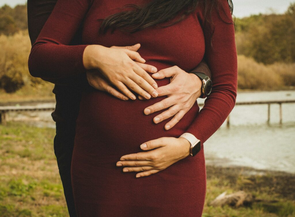 pregnant-woman-wearing-red-long-sleeved-dress-ಹೊಸ- ಕನಸೊಂದು- ನಿಜವಾಗಿದೆ